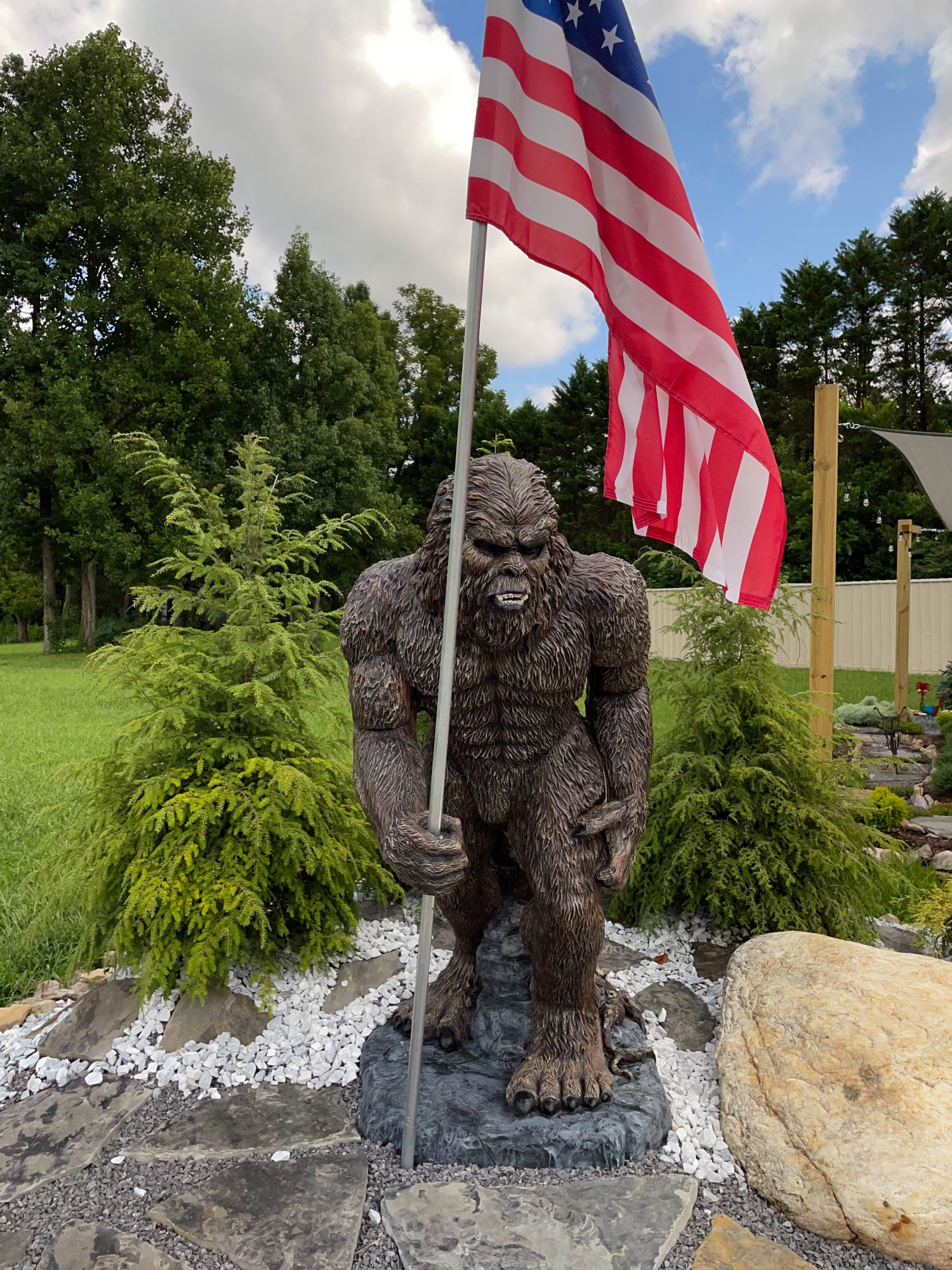 statue of Bigfoot holding American Flag in Townsend, TN