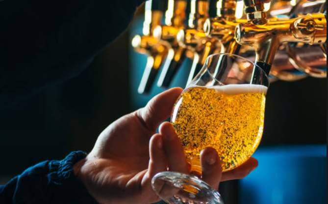 beer being poured from tap